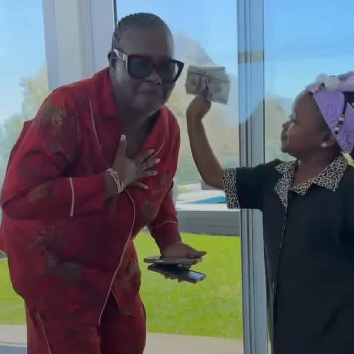 You deserve it- Nollywood Actress Oluebube Obio Surprises Adopted Mother Uche Nancy With Dollar Notes at Birthday Celebration in South Africa